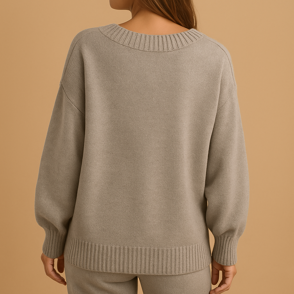 Women’s elegant V-neck knitted sweater with slim fit and soft fabric, perfect for casual wear or layered office outfits.