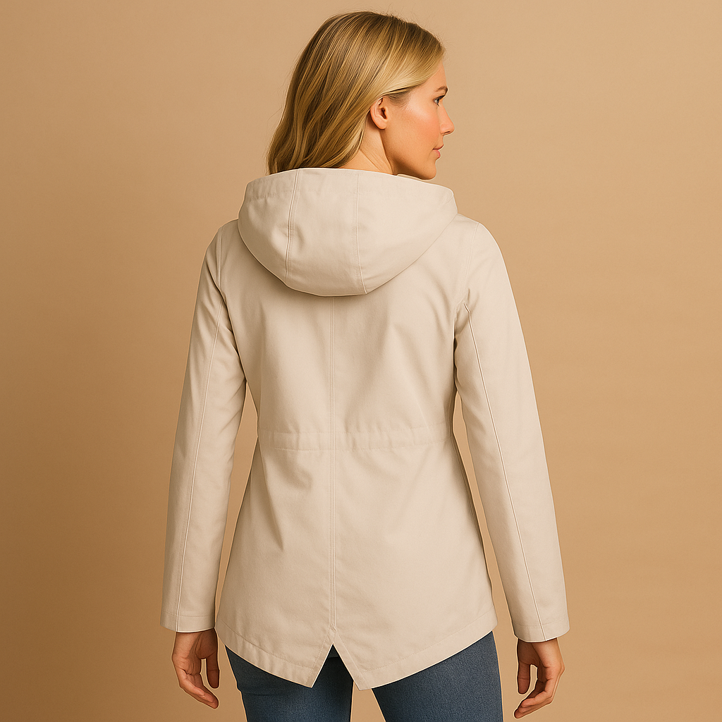 Women’s long waterproof raincoat with hood and breathable design, suitable for rainy days, commuting, and everyday outdoor wear.