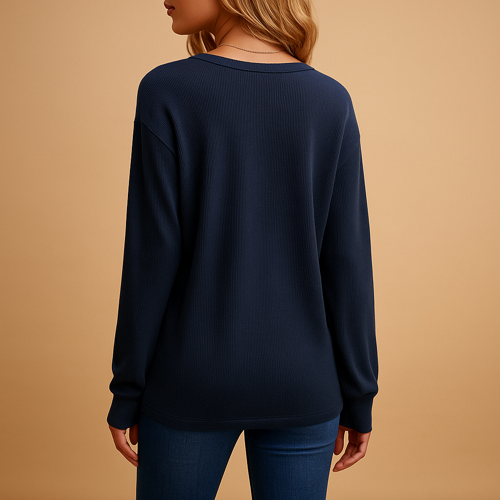 Women’s v-neck blouse with button details and a loose fit, suitable for everyday wear, office outfits, and smart casual looks.