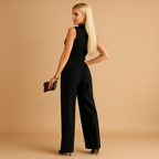 Chic wrap jumpsuit with wide legs for women in tailored fit, ideal for formal and stylish occasions.