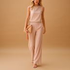 Elegant wide-leg jumpsuit for women with round neckline and mid-waist fit, ideal for work or formal occasions.