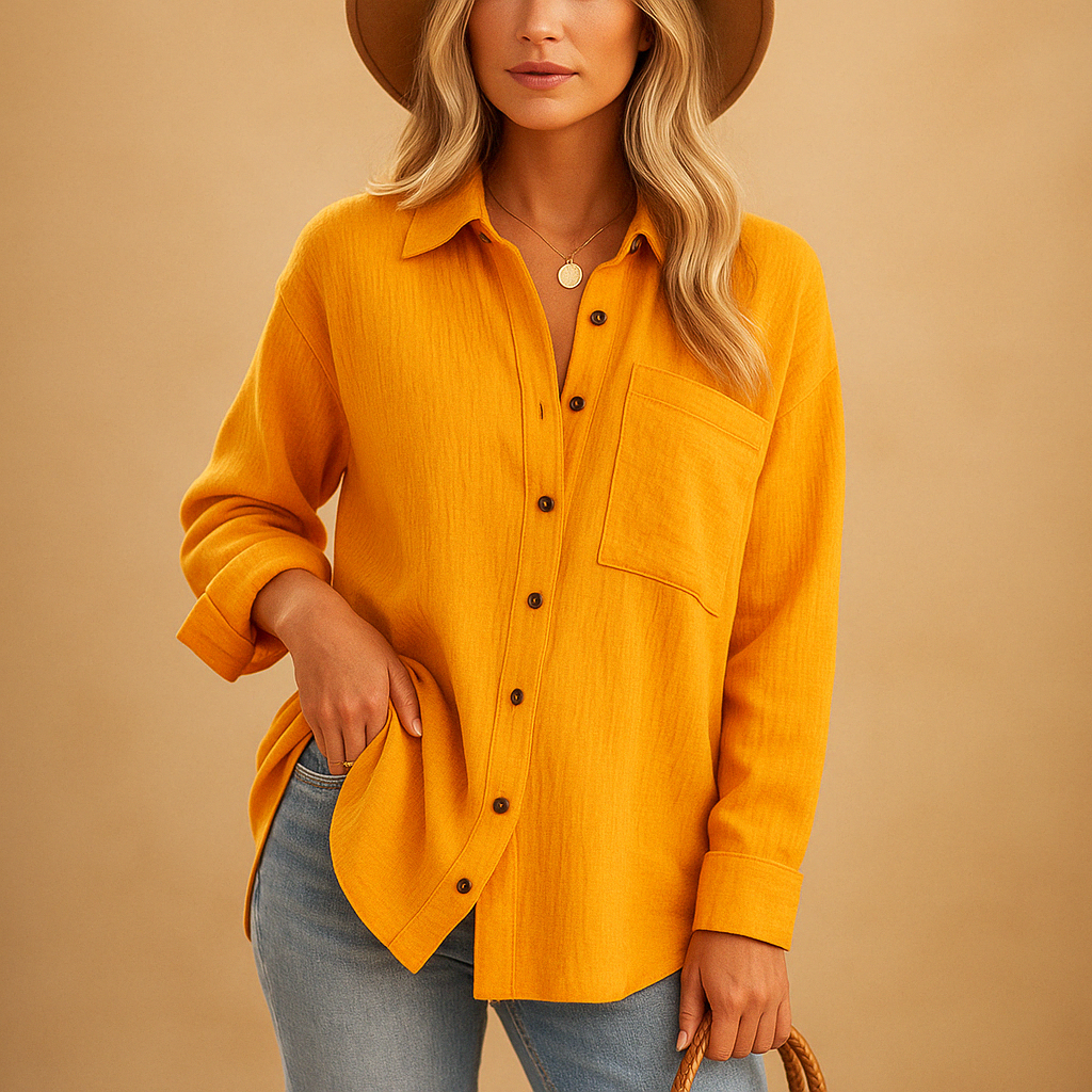 Long sleeve polo shirt for women with a relaxed fit, classic collar, and chest pocket, suitable for work and casual wear.