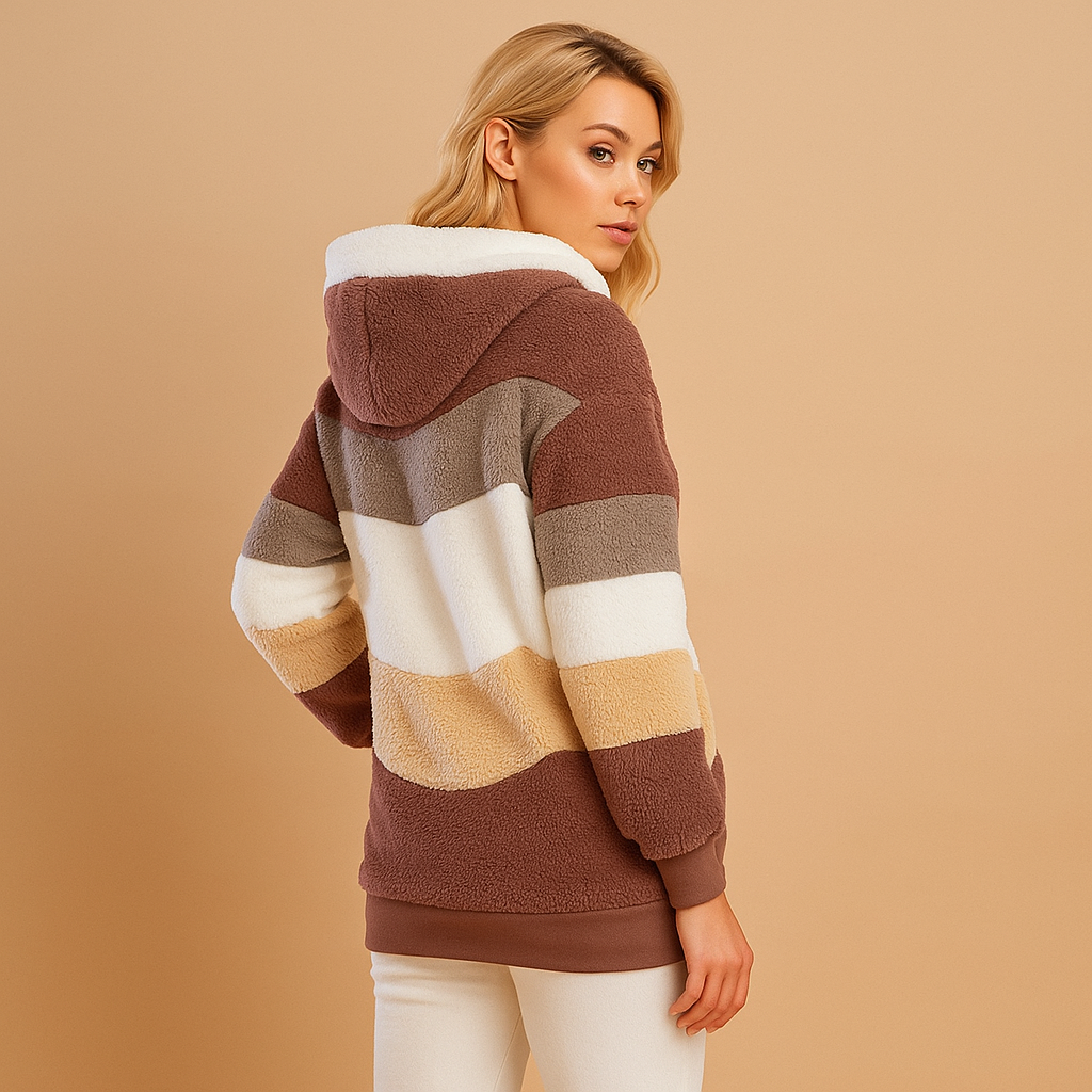 Women’s long winter coat with a soft texture and elegant silhouette, suitable for cold days, everyday wear, and seasonal outings.