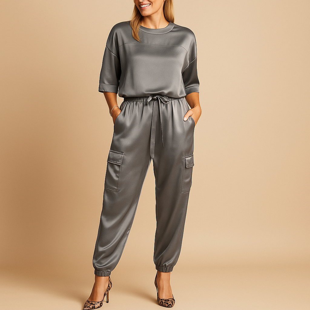 Women’s satin two-piece set with half-sleeve top and straight-leg pants, perfect for elegant evenings, home comfort, or formal events.
