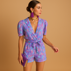 Short summer jumpsuit for women with playful print and waist belt, perfect for warm weather and stylish evenings.