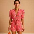 Short summer jumpsuit for women with playful print and waist belt, perfect for warm weather and stylish evenings.