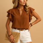 Women’s sleeveless elegant blouse with tailored fit, perfect for work, casual looks, or evening wear in classic tones.