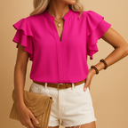 Women’s sleeveless elegant blouse with tailored fit, perfect for work, casual looks, or evening wear in classic tones.